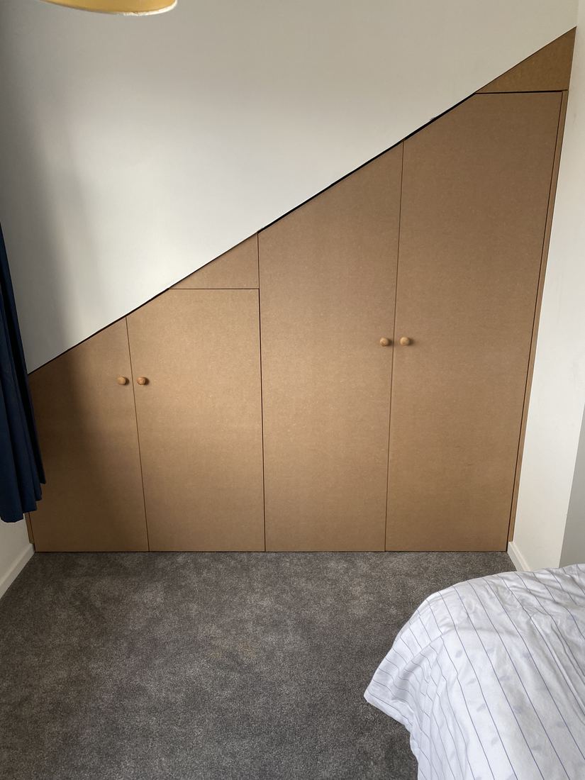 Eaves wardrobe after: fitted doors