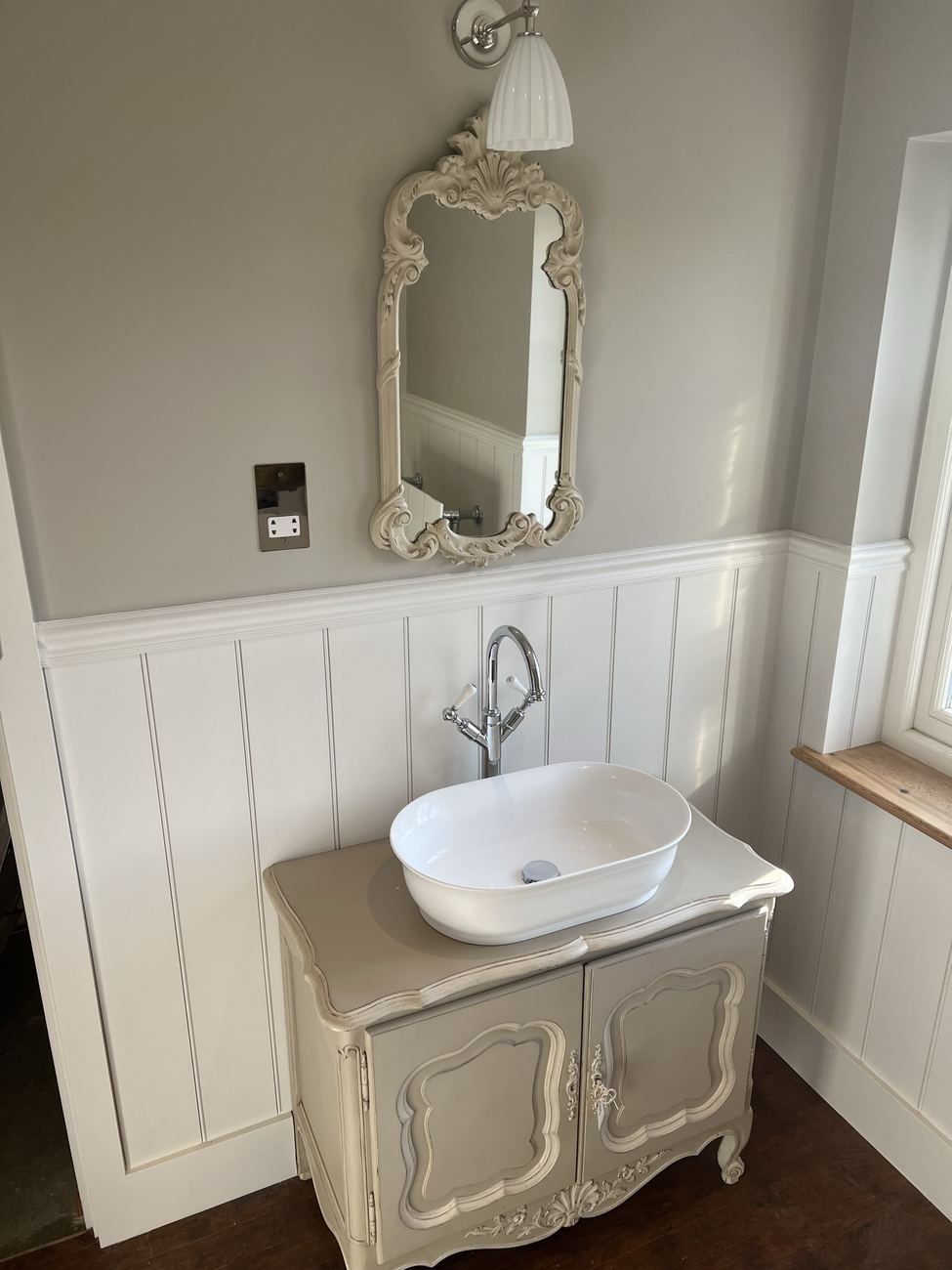 Panelled bathroom with vintage vanity unit