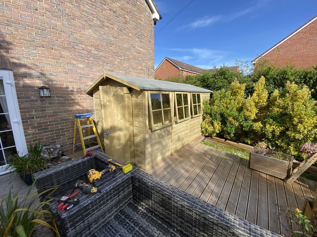 Timber summerhouse on garden decking