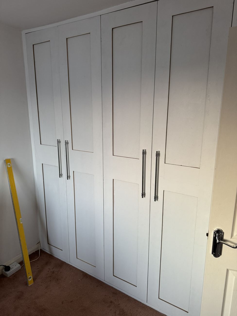 White shaker-style built-in wardrobe