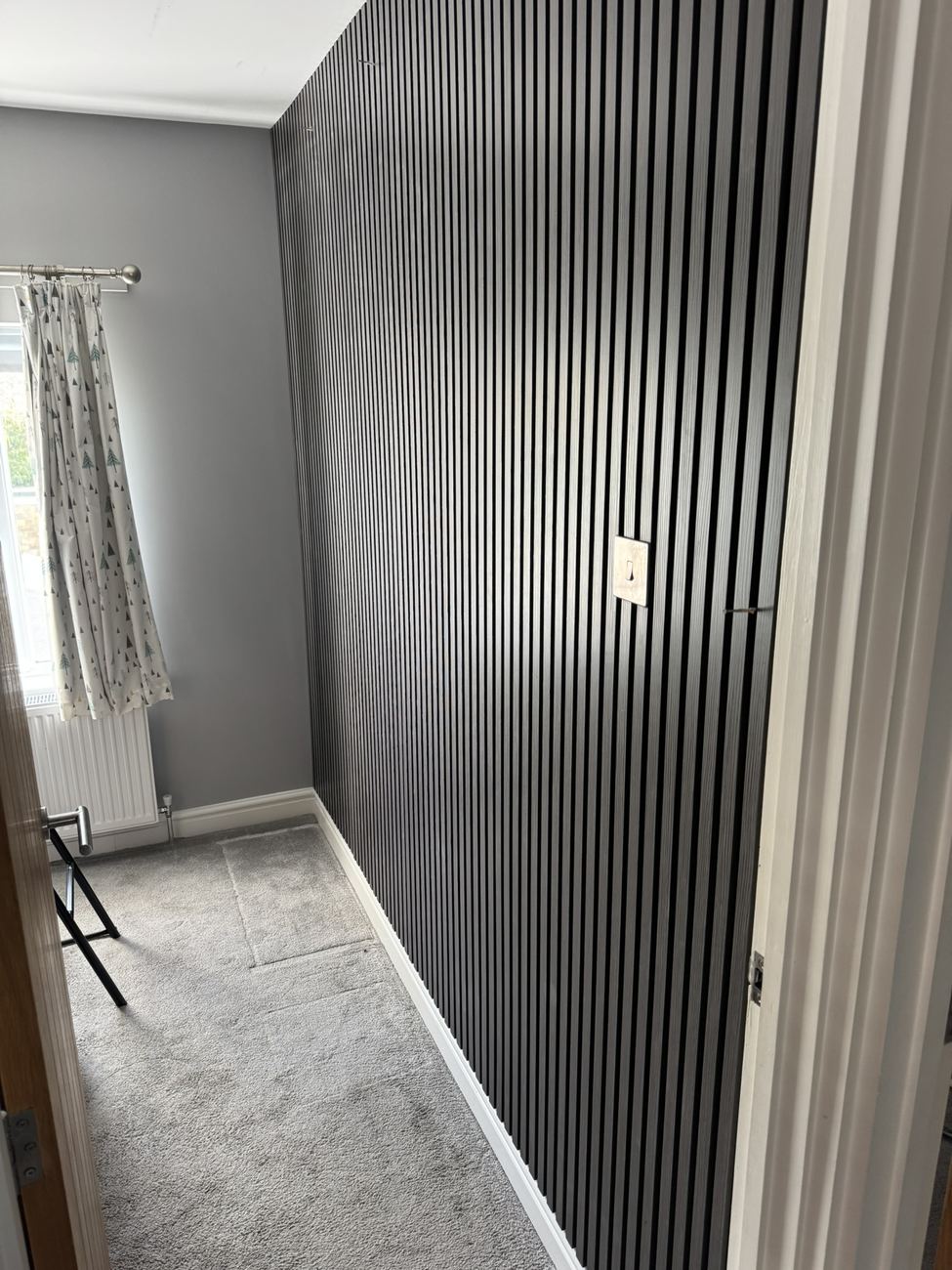 Black slatted feature wall
