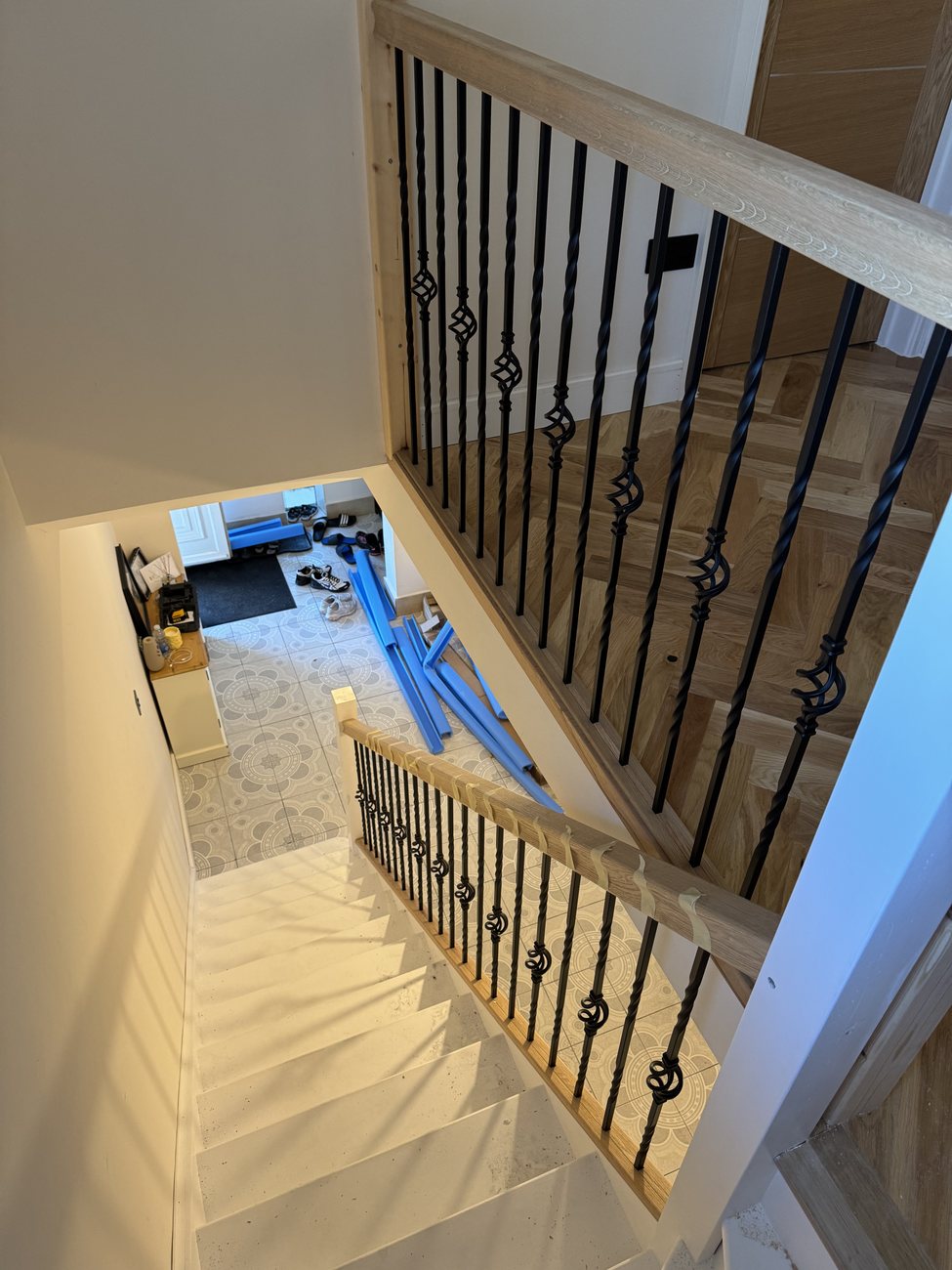 New staircase with black spindles and oak handrail
